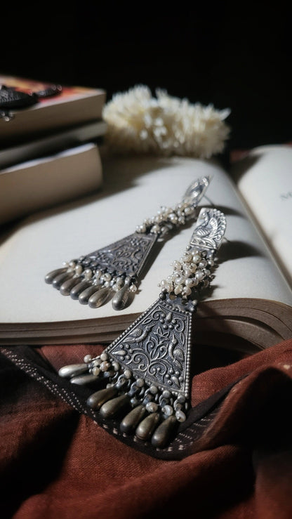 Side view of Sahaj Earrings in pure silver with handcrafted detailing