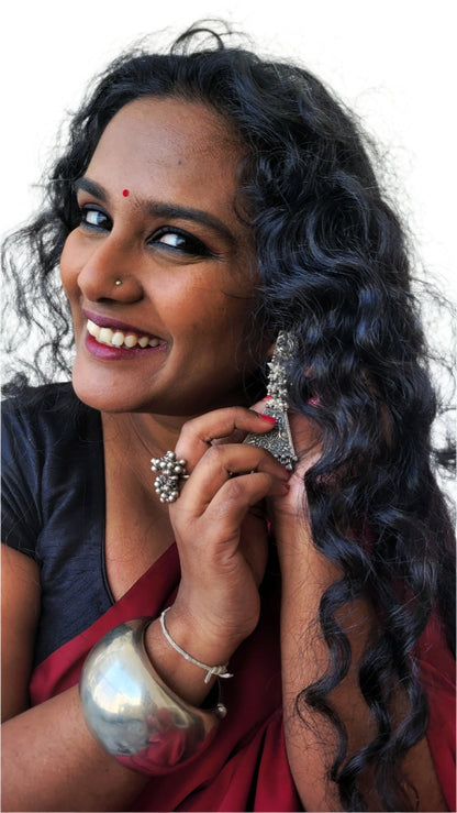Side view of Sahaj Earrings in pure silver with handcrafted detailing