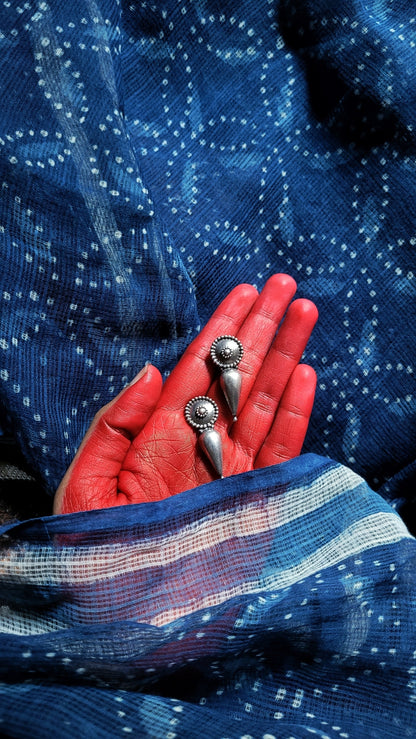 Side view of Irya Earrings in pure silver with handcrafted detailing