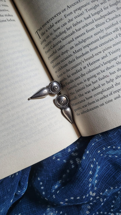 Side view of Irya Earrings in pure silver with handcrafted detailing