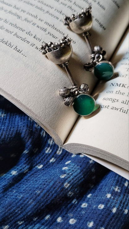 Side view of Teejh Jhumka in pure silver with handcrafted detailing
