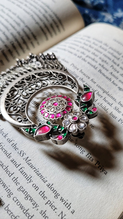Side view of Mihika Chandbaali in pure silver with handcrafted detailing