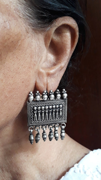 Side view of Aakar Earrings in pure silver with handcrafted detailing