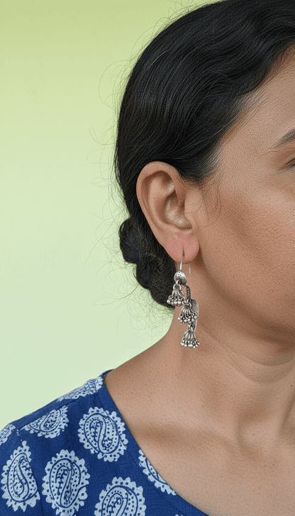 Side view of Aaral Vintage Earrings in pure silver with vintage detailing