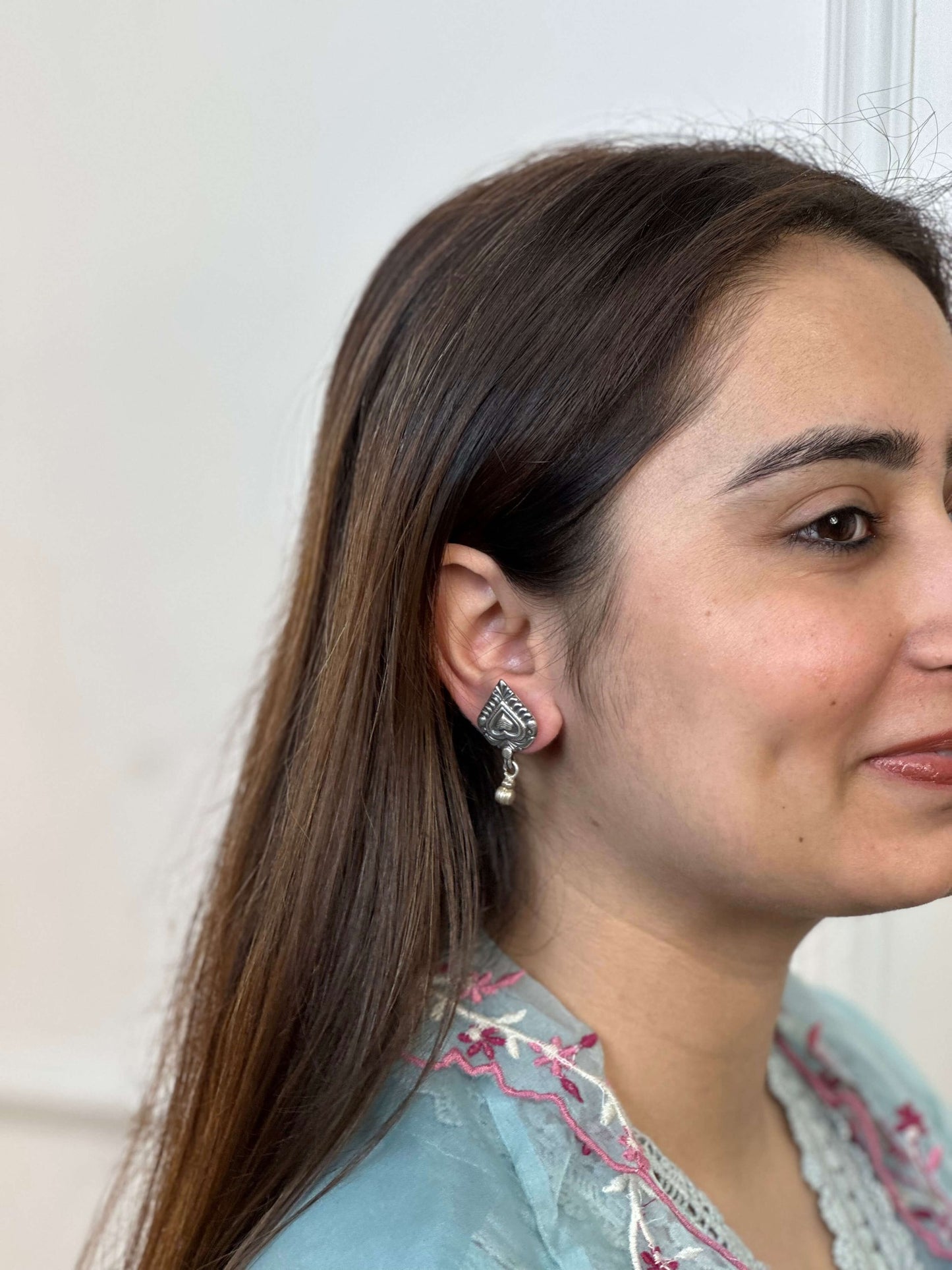 Side view of Aarzoo Earrings in pure silver with handcrafted detailing