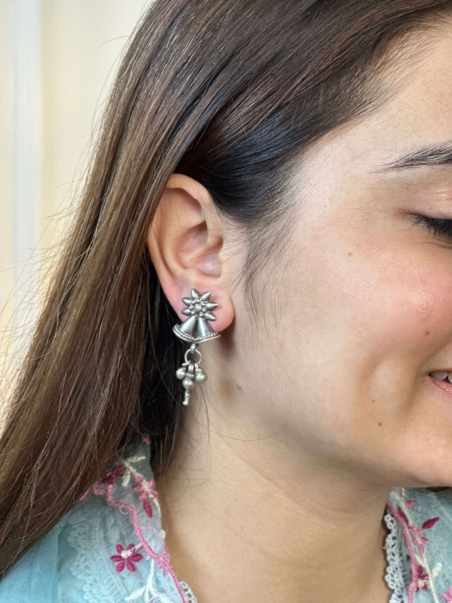 Side view of Adi Earrings in pure silver with handcrafted detailing