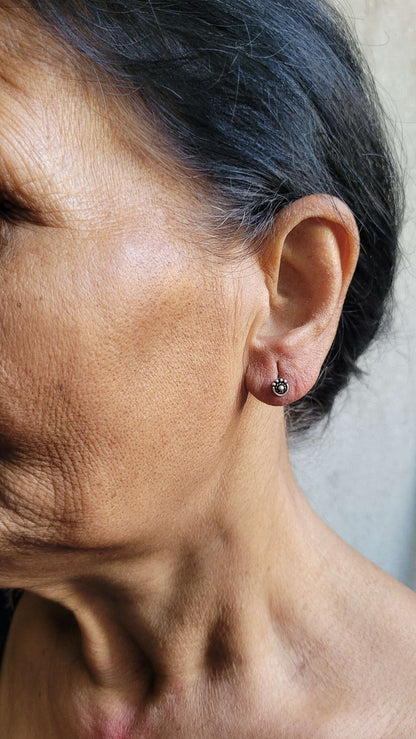 Side view of Ananta Studs in pure silver with handcrafted detailing