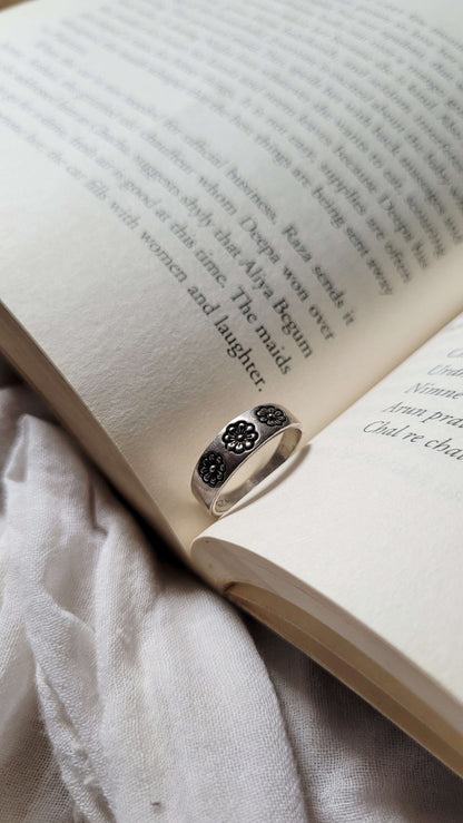 Side view of Ankur Ring in pure silver with handcrafted detailing