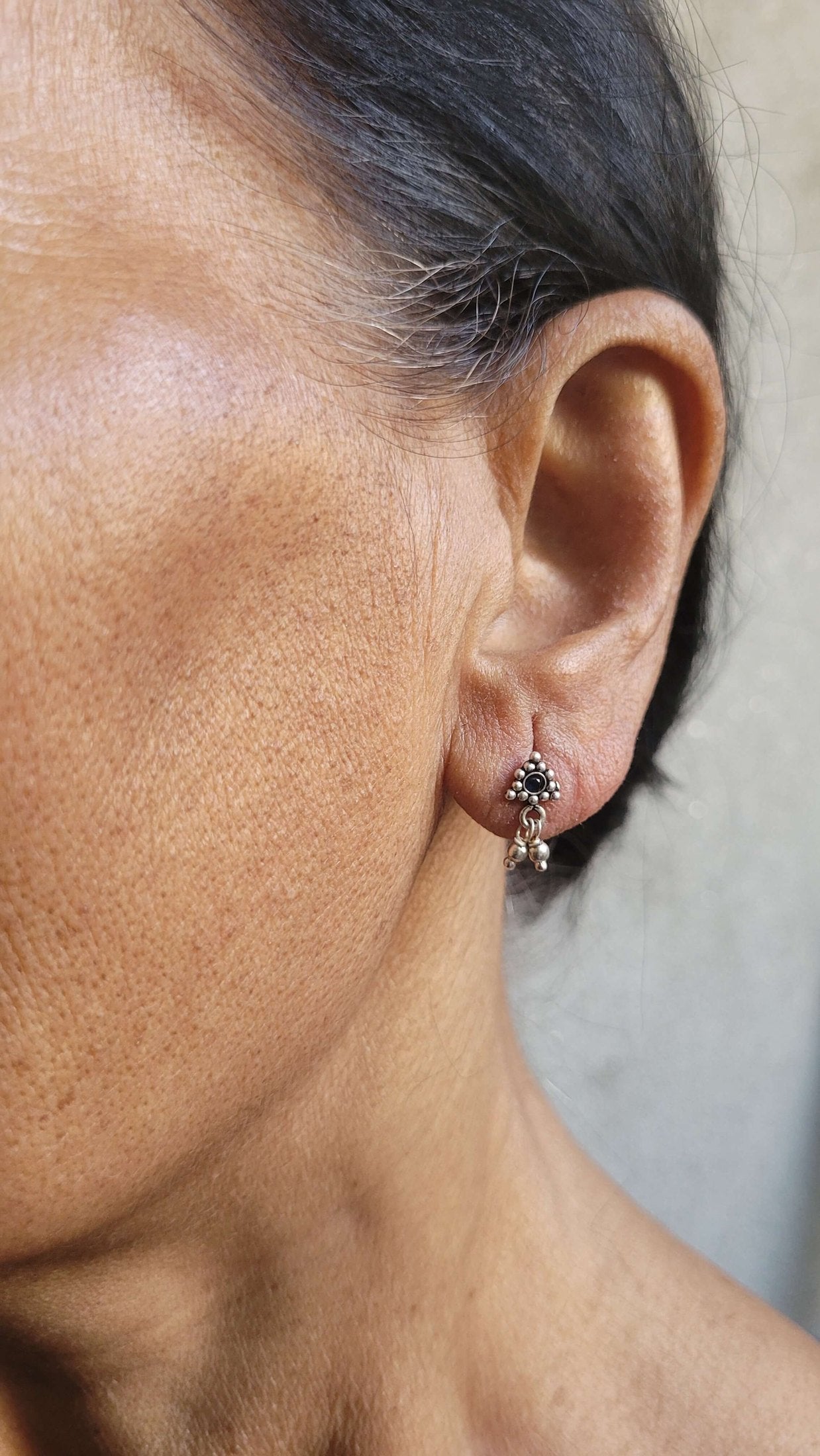 Side view of Athenia Studs in pure silver with handcrafted detailing