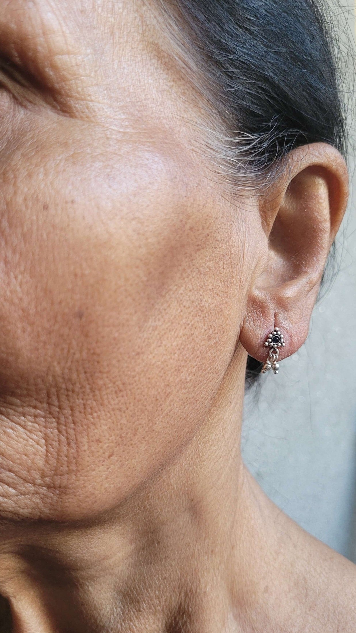 Side view of Athenia Studs in pure silver with handcrafted detailing