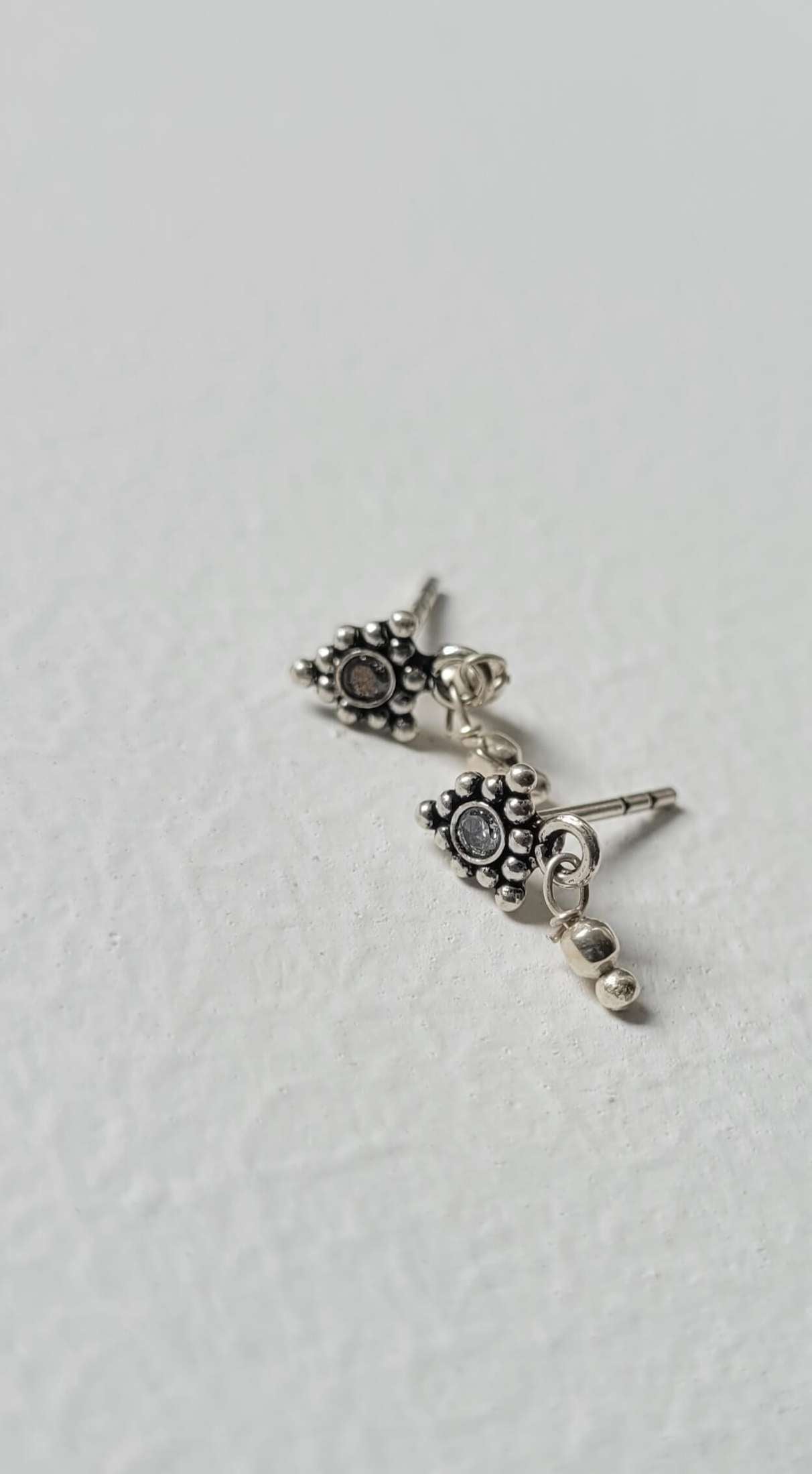 Side view of Athenia Studs in pure silver with handcrafted detailing