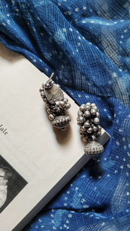 Side view of Bandhan Earrings in pure silver with handcrafted detailing