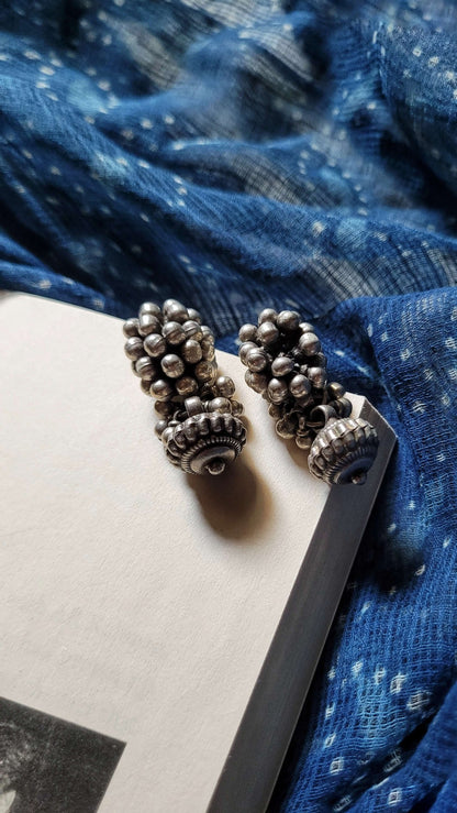 Side view of Bandhan Earrings in pure silver with handcrafted detailing