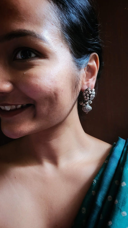 Side view of Bandhan Earrings in pure silver with handcrafted detailing