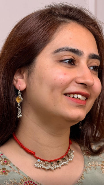 Vintage silver katesari earrings worn with a glass necklace