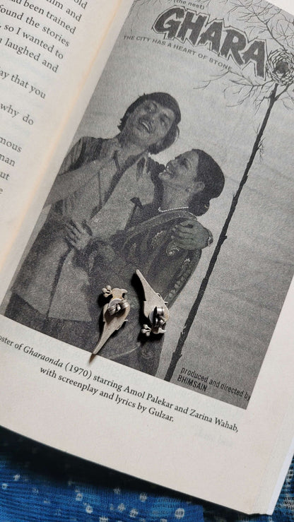 Side view of Bulbul Earrings in pure silver with handcrafted detailing