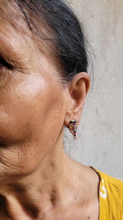 Side view of Bulbul Earrings in pure silver with handcrafted detailing