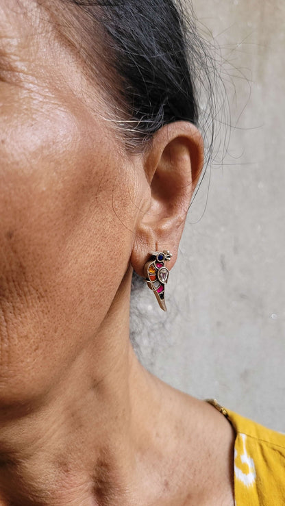 Side view of Bulbul Earrings in pure silver with handcrafted detailing