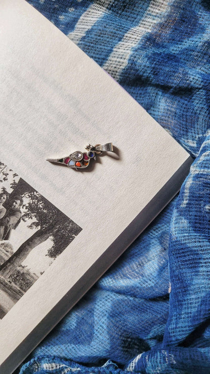 Side view of Bulbul Pendant in pure silver with handcrafted detailing