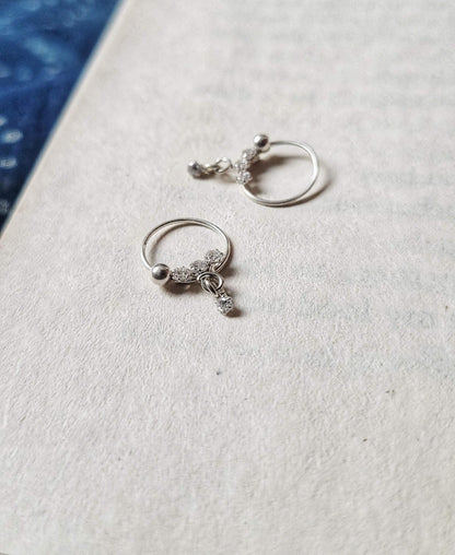 Side view of Chamak Hoops in pure silver with handcrafted detailing