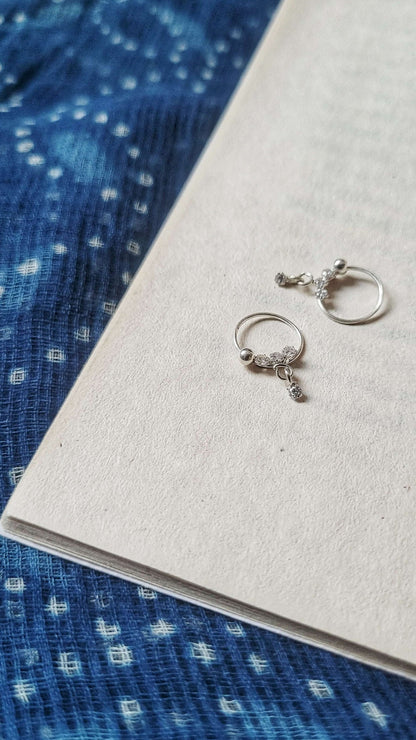 Side view of Chamak Hoops in pure silver with handcrafted detailing