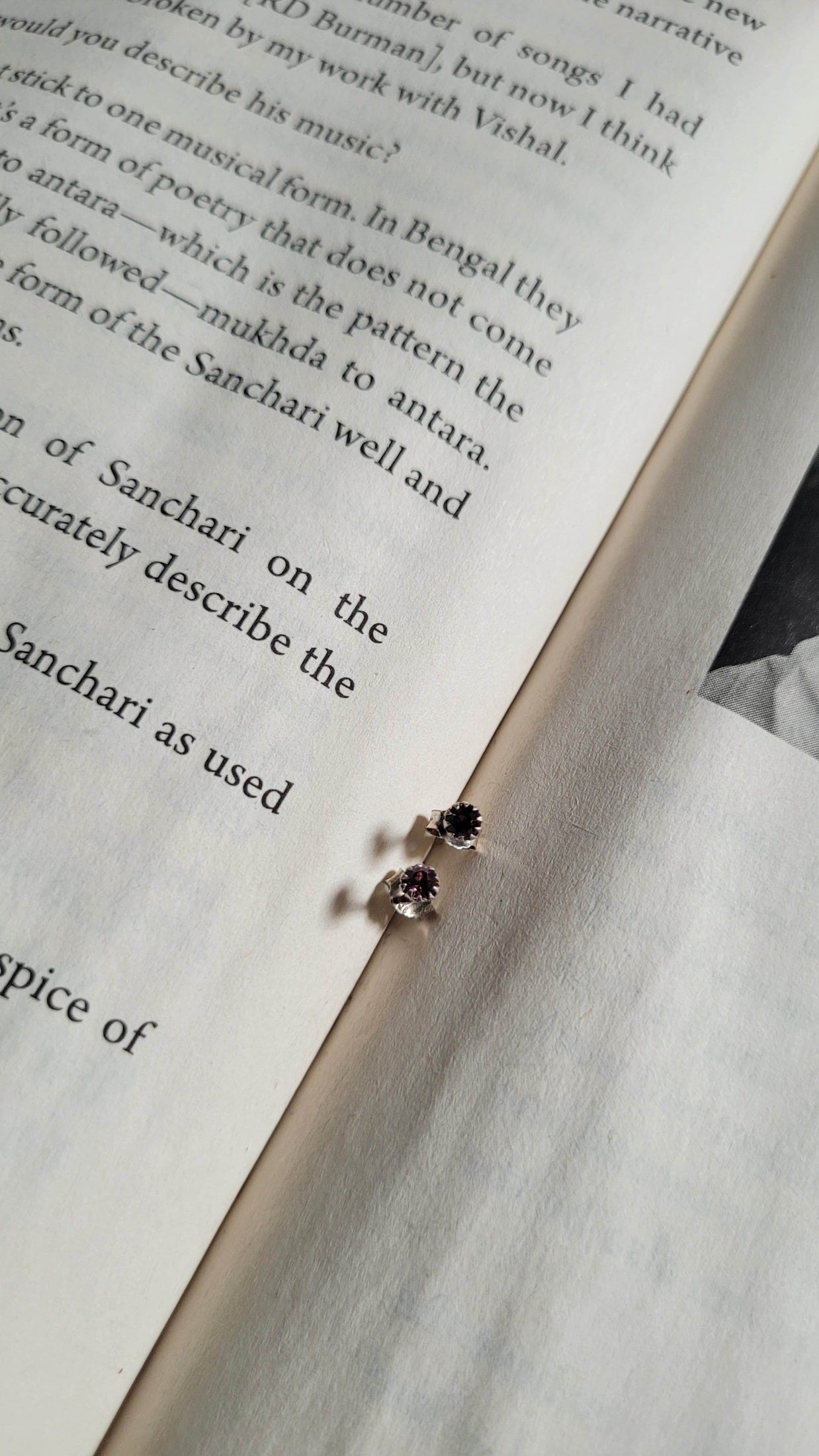 Earring on an open book with text