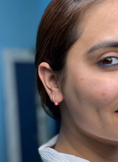 Side view of Cheshm Nazar Hoops in pure silver with handcrafted detailing