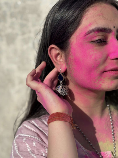 Side view of Falak Jhumka in pure silver with handcrafted detailing