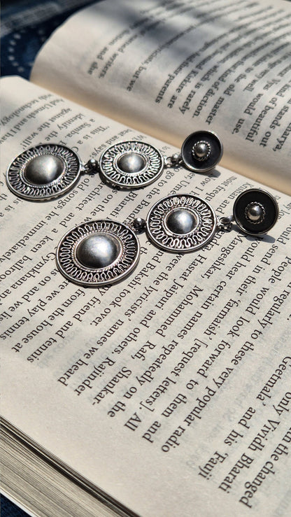 Side view of Gol Matol Earrings in pure silver with handcrafted detailing