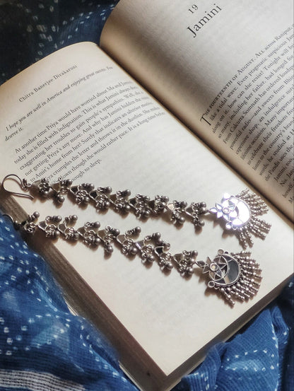 Side view of Hania Shoulder-Duster Earrings in pure silver with handcrafted detailing