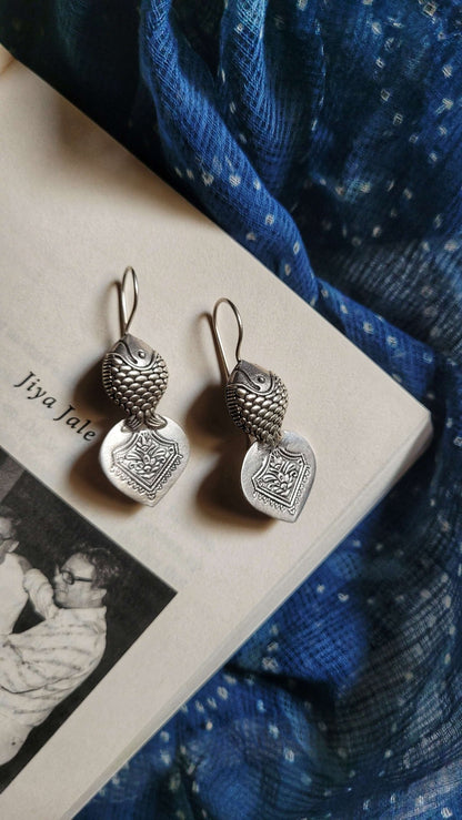 Side view of Hilsa Earrings in pure silver with handcrafted detailing