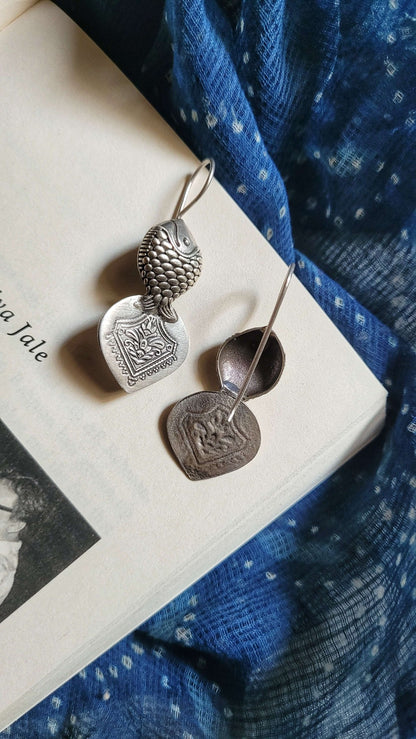 Side view of Hilsa Earrings in pure silver with handcrafted detailing