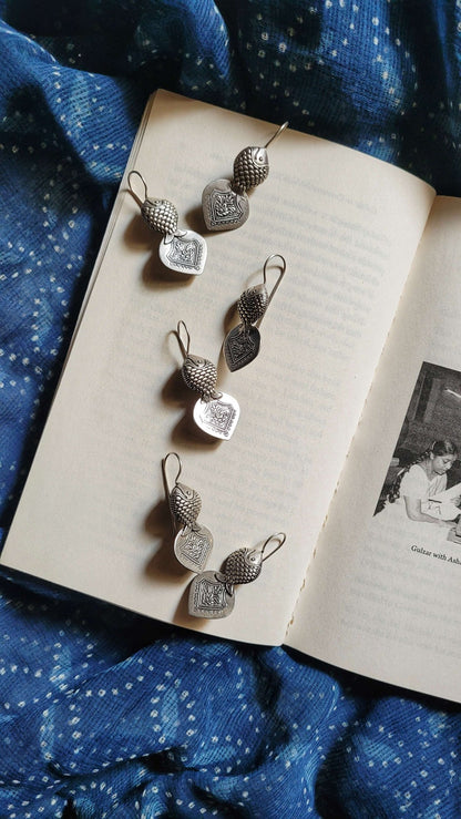 Side view of Hilsa Earrings in pure silver with handcrafted detailing