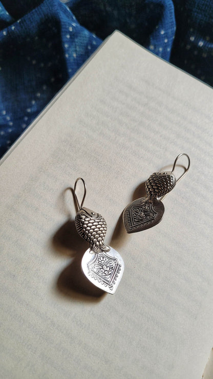 Side view of Hilsa Earrings in pure silver with handcrafted detailing