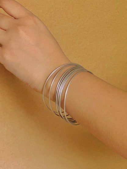 Side view of Kora Bangles in pure silver with handcrafted detailing