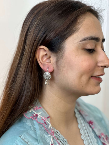 Side view of Ibtida Vintage Earrings in pure silver with vintage detailing