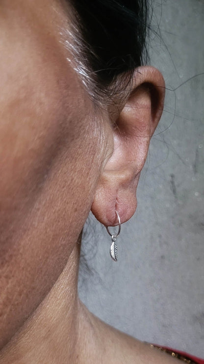 Side view of Ilai Hoops in pure silver with handcrafted detailing