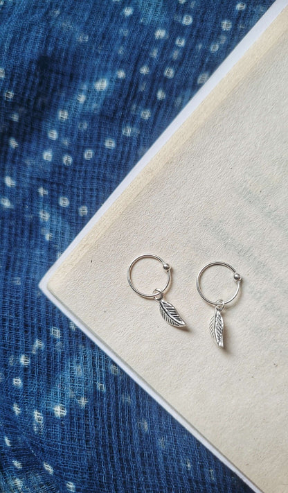 Side view of Ilai Hoops in pure silver with handcrafted detailing