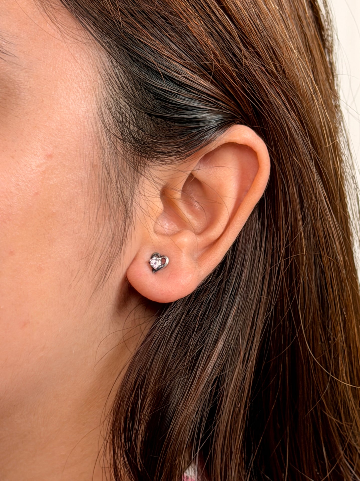 Iqraar Studs worn
