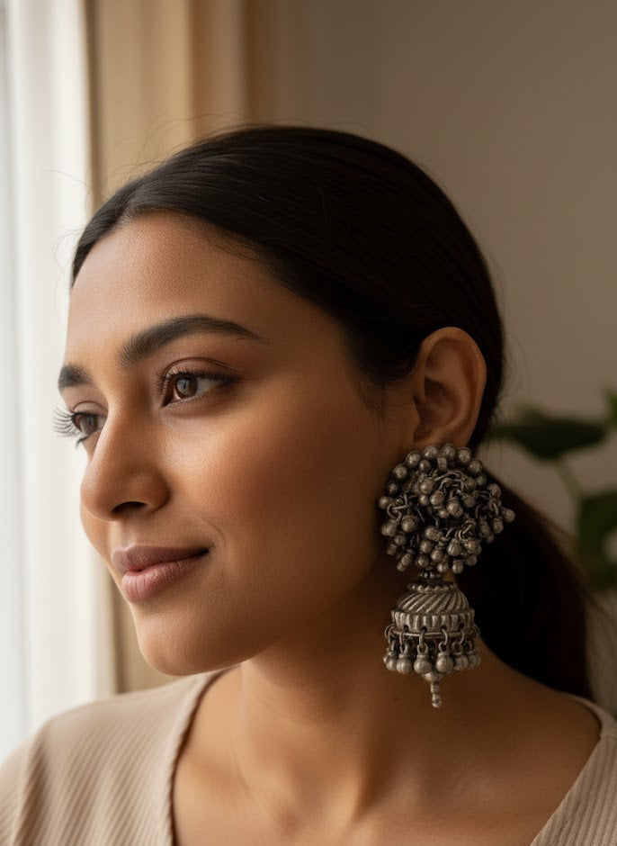 Vintage silver jhumkas with overloaded ghungroo stud and ghungroo-laden layered jhumka, bold statement Indian silver earrings