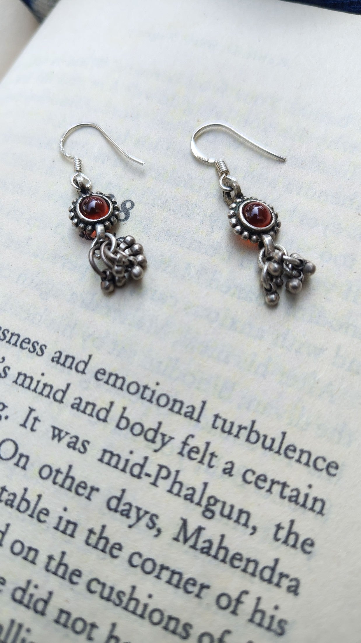 Sadabahaar Jewelry Authentic Vintage Silver Earrings with Red Stone Floral Embossing and Ghungroos for Women - side view