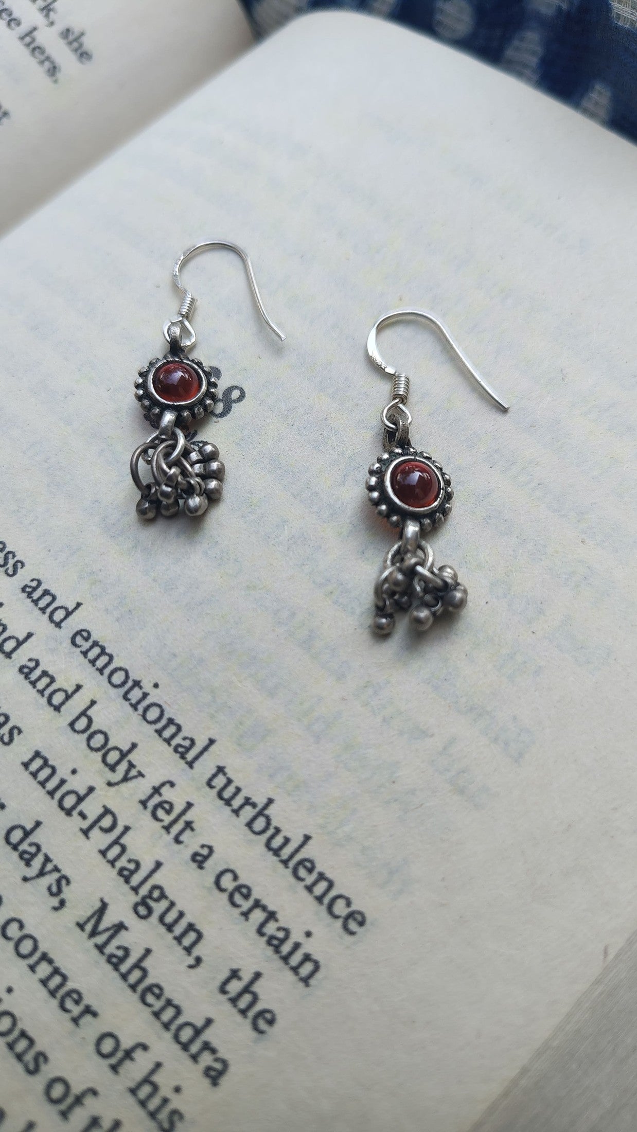 Sadabahaar Jewelry Authentic Vintage Silver Earrings with Red Stone Floral Embossing and Ghungroos for Women - top view