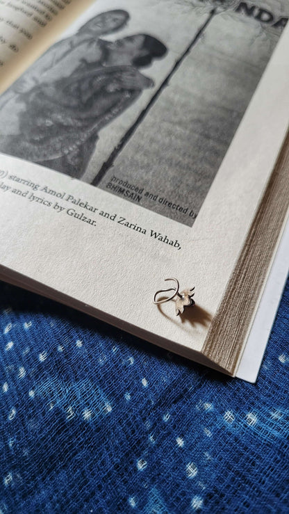 Side view of Kamal Nose-Pin in pure silver with handcrafted detailing