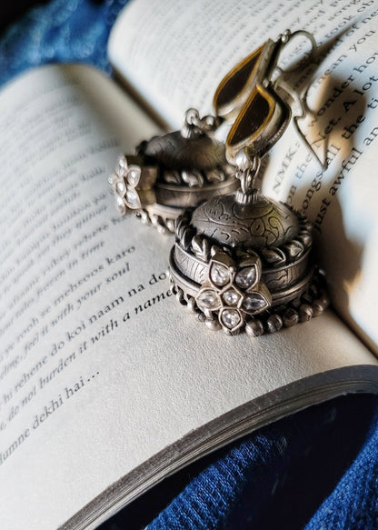 Side view of Kapaas Jhumka in pure silver with handcrafted detailing