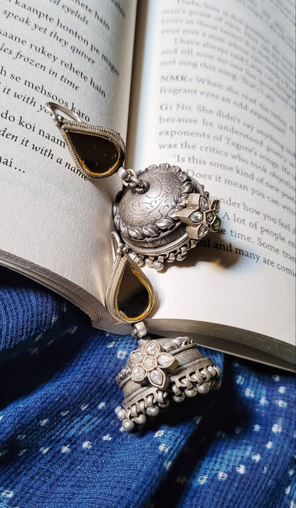 Side view of Kapaas Jhumka in pure silver with handcrafted detailing