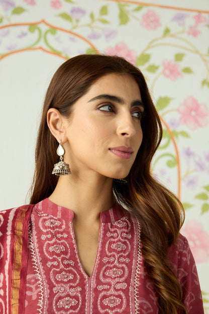 Side view of Kapaas Jhumka in pure silver with handcrafted detailing