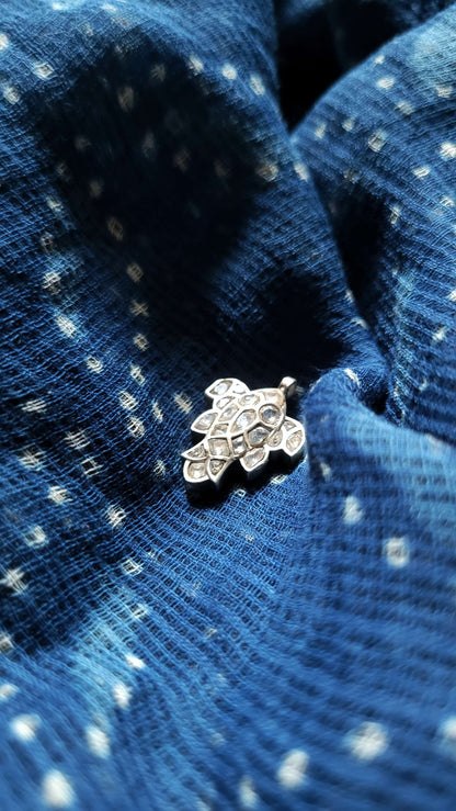 Side view of Katla Pendant in pure silver with handcrafted detailing