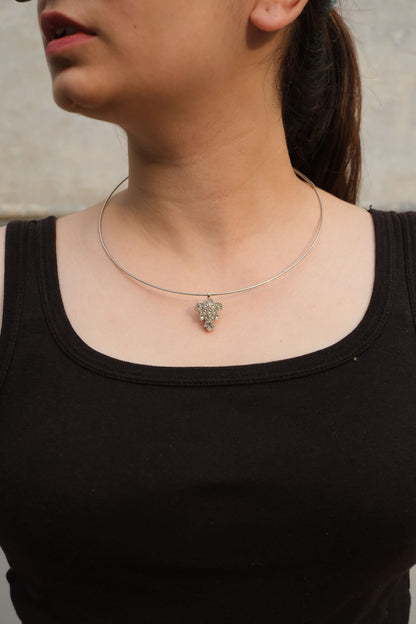 Side view of Katla Pendant in pure silver with handcrafted detailing