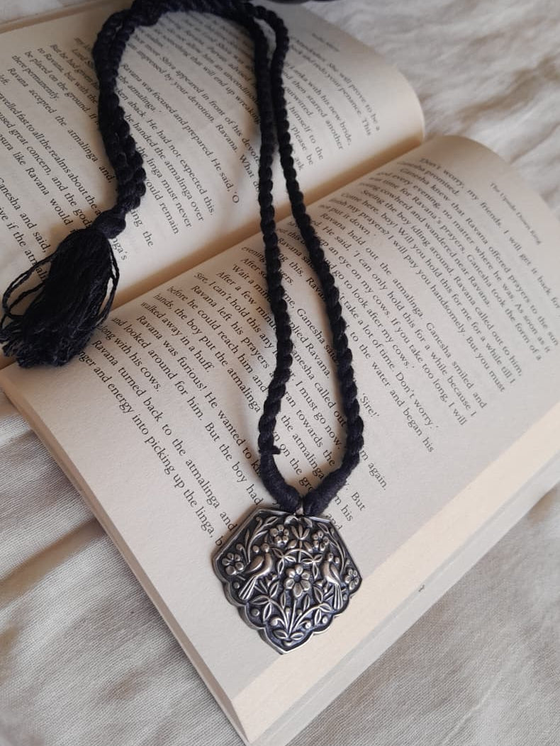 Sadabahaar Jewelry 92.5 hallmark silver embossed bird floral pendant necklace scalloped edge black thread tassel minimalist daily wear - top view
