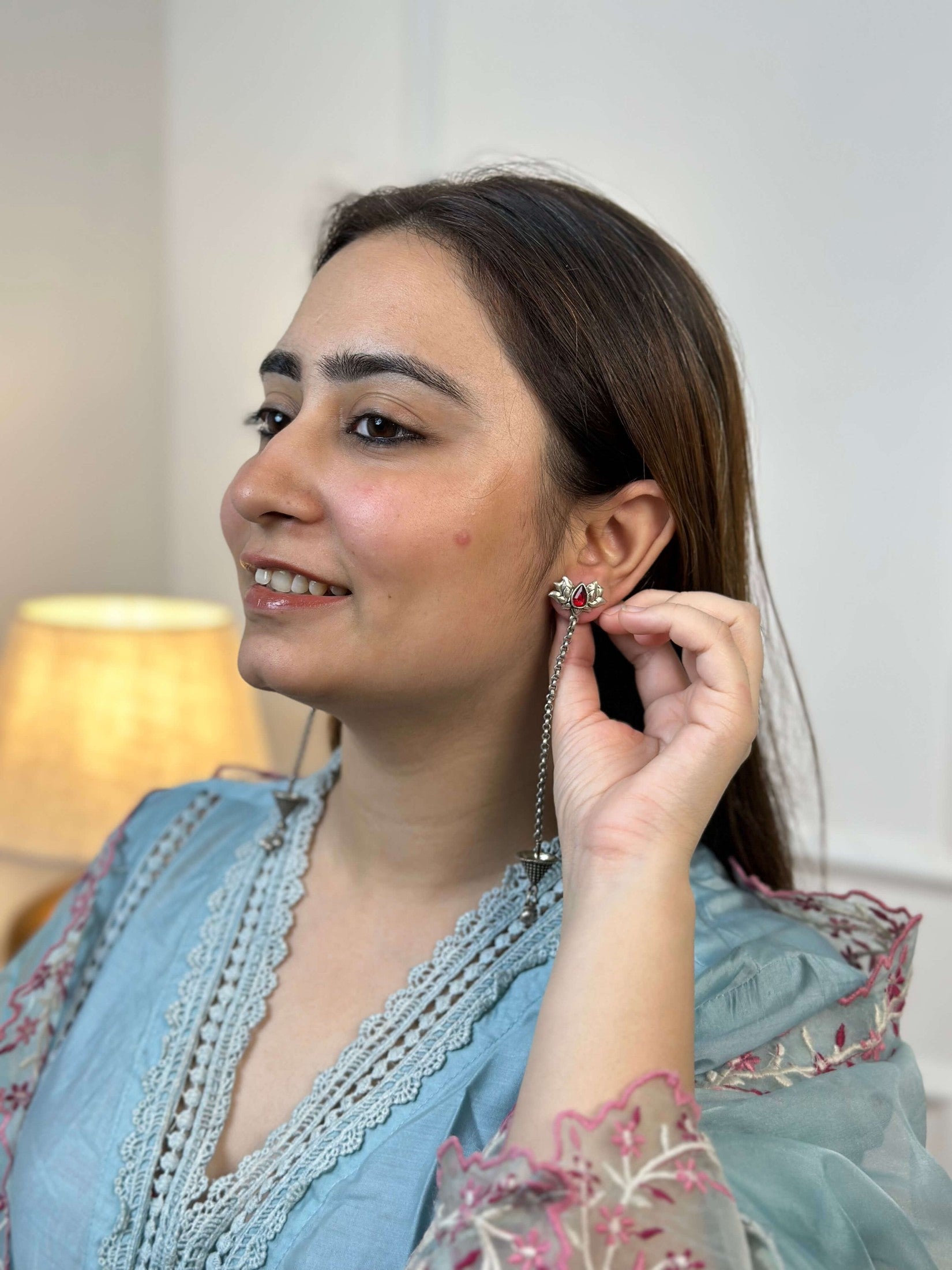 Side view of Kumkum Earrings in pure silver with handcrafted detailing